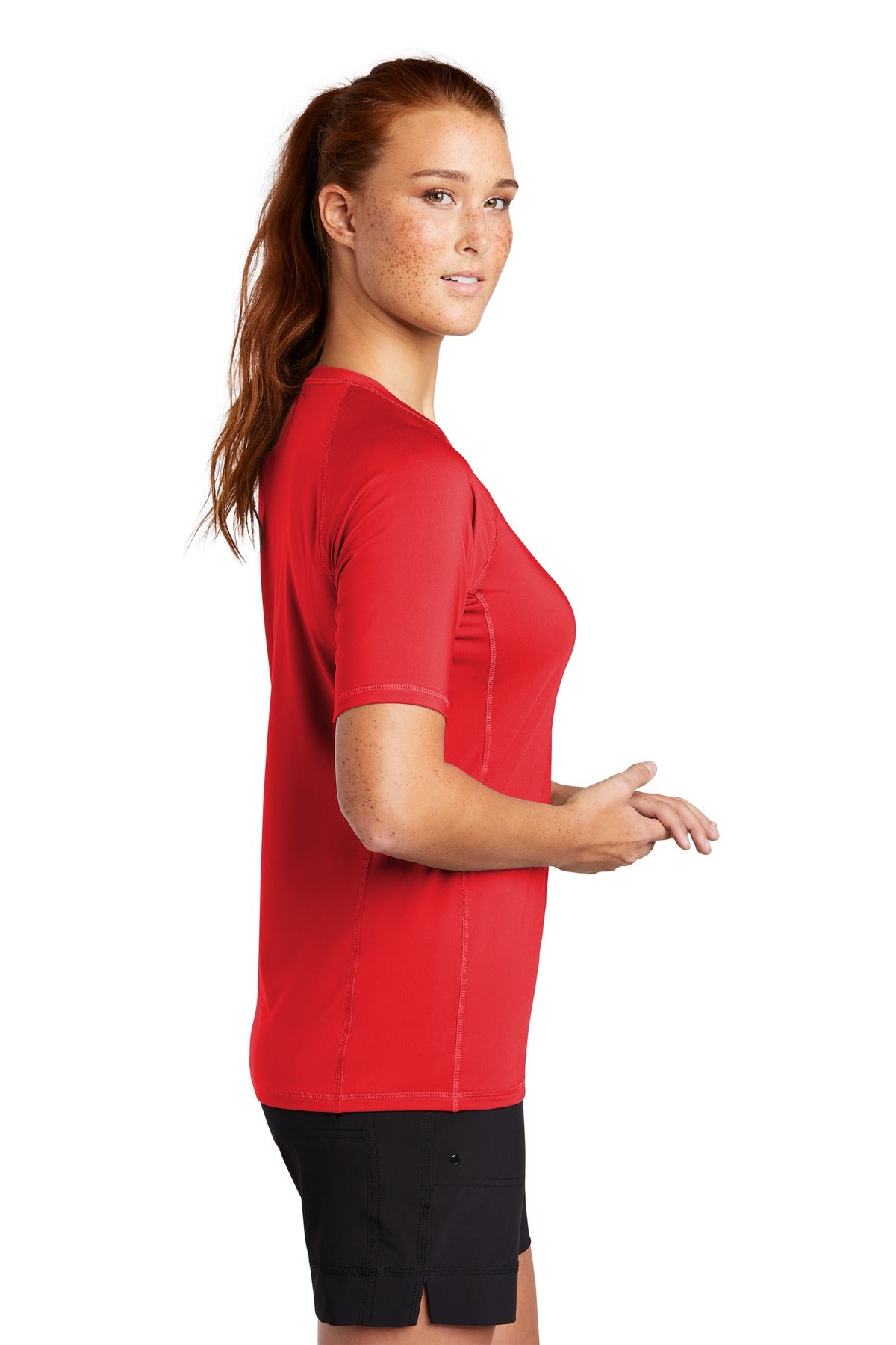 True Red Sport-Tek Women's Rashguard Tee. LST470